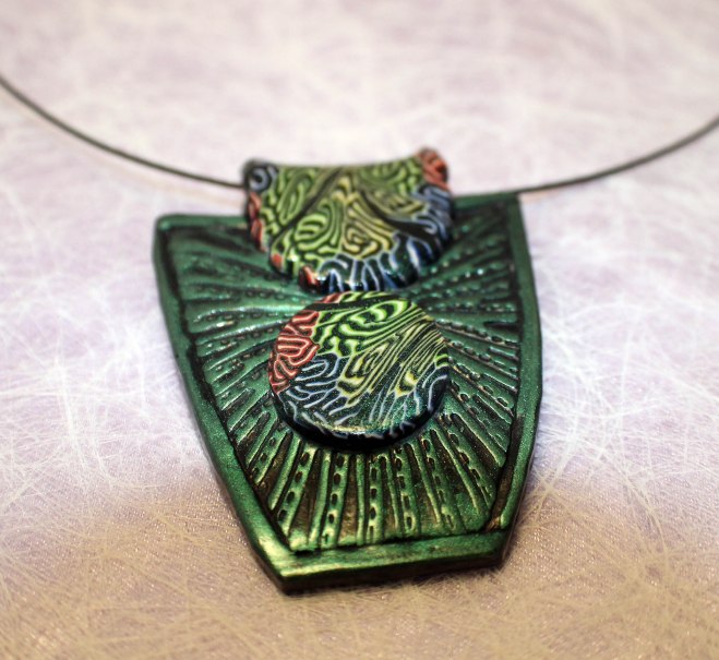 IMG_6344 Emerald shield pendant with brain cane